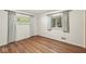 Bedroom featuring hardwood floors and windows with curtains allowing natural light at 5841 N Parker Ave, Indianapolis, IN 46220