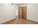 This bedroom boasts hardwood floors, a closet, and an open doorway to the rest of the home at 5841 N Parker Ave, Indianapolis, IN 46220