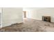 Spacious living room featuring a fireplace, carpet flooring, and ample natural light at 5841 N Parker Ave, Indianapolis, IN 46220