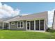Gray vinyl house has a screened in porch and a green lawn, surrounded by neighboring homes at 624 Faudree Dr, Westfield, IN 46074