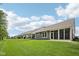 Long green yard behind gray vinyl houses, with screened in back porches and sunny skies at 624 Faudree Dr, Westfield, IN 46074