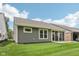 Enjoy this neatly mowed backyard with gray vinyl siding and a brick patio at 624 Faudree Dr, Westfield, IN 46074
