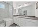 Bright bathroom features a double sink vanity and a glass enclosed shower with bench seating at 624 Faudree Dr, Westfield, IN 46074