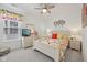 Cozy bedroom with floral accents, ceiling fan, and a well-lit ambiance at 624 Faudree Dr, Westfield, IN 46074