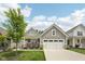 Charming single-story home featuring a well-manicured lawn, a two-car garage, and pleasing architectural details at 624 Faudree Dr, Westfield, IN 46074