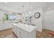 Open kitchen featuring a large island with pendant lighting and seating at 624 Faudree Dr, Westfield, IN 46074