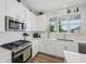 Well-lit kitchen with stainless steel oven, modern appliances, and white subway tile backsplash at 624 Faudree Dr, Westfield, IN 46074