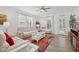 Comfortable living room with neutral furniture, a ceiling fan, and abundant natural light at 624 Faudree Dr, Westfield, IN 46074
