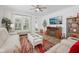 Inviting living room with neutral tones, a fireplace, and access to the outdoor area at 624 Faudree Dr, Westfield, IN 46074