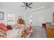 Open main bedroom with a sitting area, tray ceilings, and ensuite bathroom access at 624 Faudree Dr, Westfield, IN 46074