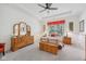 Spacious main bedroom with tray ceiling, dresser, and bright natural light at 624 Faudree Dr, Westfield, IN 46074