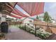 Relaxing backyard features a covered patio, beautiful landscaping, and a cozy seating area at 629 S Miller St, Shelbyville, IN 46176