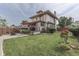 Beautiful backyard featuring a green lawn, fire pit, flowering plants and patio at 629 S Miller St, Shelbyville, IN 46176