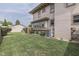 Well-maintained backyard with a green lawn, foliage, and partial house view at 629 S Miller St, Shelbyville, IN 46176