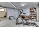 Finished basement with workout machine, desk, computer, bookcase and textured wallpaper at 629 S Miller St, Shelbyville, IN 46176