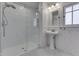 Stylish bathroom with subway tile shower, mosaic tile floor, and pedestal sink at 629 S Miller St, Shelbyville, IN 46176