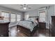 This bedroom features natural lighting, dark wood floors and neutral paint at 629 S Miller St, Shelbyville, IN 46176