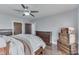 Bedroom with lots of natural light and dark wood furniture and trim at 629 S Miller St, Shelbyville, IN 46176