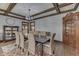 Dining room with coffered ceiling, chandelier, and seating for eight at 629 S Miller St, Shelbyville, IN 46176