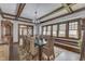 Elegant dining room featuring a coffered ceiling, modern chandelier, and seating for eight at 629 S Miller St, Shelbyville, IN 46176