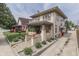 Beautiful two-story home with charming front porch, landscaping, and inviting curb appeal at 629 S Miller St, Shelbyville, IN 46176