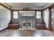 Living Room featuring fireplace with mirror and window nook at 629 S Miller St, Shelbyville, IN 46176