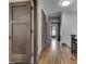 Hallway features hardwood floors and classic wood doors at 629 S Miller St, Shelbyville, IN 46176