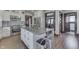 Spacious kitchen with a stainless steel oven, range hood and adjacent dining area at 629 S Miller St, Shelbyville, IN 46176