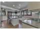 Bright kitchen with stainless appliances, a large island, subway tile, and wood framed windows at 629 S Miller St, Shelbyville, IN 46176