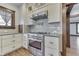 Gourmet kitchen featuring stainless steel appliances, ample storage, and stylish finishes at 629 S Miller St, Shelbyville, IN 46176