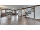 Spacious living room with wooden floors, dark trim, fireplace, and ample natural light at 629 S Miller St, Shelbyville, IN 46176