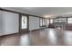 Spacious living room featuring hardwood floors and a decorative fireplace at 629 S Miller St, Shelbyville, IN 46176