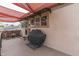 Charming outdoor patio with an awning and grill, perfect for entertaining guests in a cozy space at 629 S Miller St, Shelbyville, IN 46176