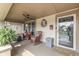 Relaxing front porch with furniture, ceiling fan, and exterior door at 629 S Miller St, Shelbyville, IN 46176