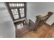 A wood staircase and stained glass window adding historic character to the home at 629 S Miller St, Shelbyville, IN 46176