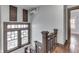Staircase with wood detail and a view of stained glass windows at the landing at 629 S Miller St, Shelbyville, IN 46176