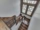 A detailed look at the wooden staircase and stained glass window showing character at 629 S Miller St, Shelbyville, IN 46176