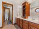 Bathroom featuring double vanity, wood cabinets, tile floor and a separate toilet at 6629 Woodcrest Dr, Avon, IN 46123