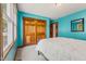 Bedroom with blue walls, natural light and a closet, a practical space at 6629 Woodcrest Dr, Avon, IN 46123