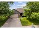 Aerial view of a single-story brick home with an attached two-car garage and a well-maintained front lawn at 6629 Woodcrest Dr, Avon, IN 46123