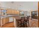 Kitchen with a large island, hardwood floors, and backyard views at 6629 Woodcrest Dr, Avon, IN 46123