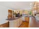 Well-lit kitchen featuring modern appliances and custom wood cabinets offering ample storage and style at 6629 Woodcrest Dr, Avon, IN 46123