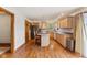 Warm kitchen with a functional island, lots of cabinets, and gleaming hardwood floors at 6629 Woodcrest Dr, Avon, IN 46123
