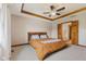 Spacious main bedroom featuring tray ceiling, ceiling fan and an ensuite bath at 6629 Woodcrest Dr, Avon, IN 46123