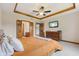 Comfortable main bedroom with hardwood trim, TV, and furniture creates a cozy retreat at 6629 Woodcrest Dr, Avon, IN 46123