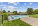 Backyard with in-ground pool, pond view and outdoor seating on the new deck area at 6629 Woodcrest Dr, Avon, IN 46123