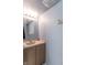 Neutral bathroom with modern vanity, stylish mirror, and great lighting at 6635 Blackthorn Dr, Indianapolis, IN 46221