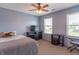 Comfortable bedroom with carpet and neutral walls, with ample natural light from the windows at 6635 Blackthorn Dr, Indianapolis, IN 46221