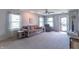 Bright living room with neutral paint, plush carpet, and comfortable seating for relaxation at 6635 Blackthorn Dr, Indianapolis, IN 46221