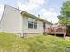 View of the home's backyard and wood deck with chairs, ideal for outdoor entertaining at 6637 Sundown S Dr, Indianapolis, IN 46254